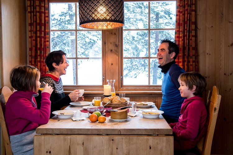 Family enjoying breakfast. Cabin life at Lemonsjø.